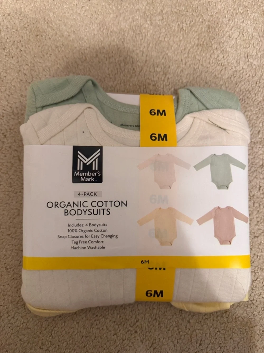 Member's Mark Organic Cotton 4-Pack Baby Bodysuits - Green, Cream, Yellow, Pink